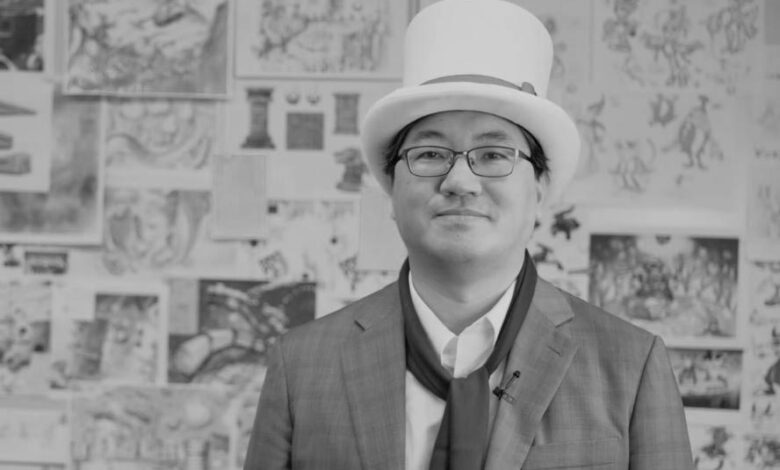 Yuji Naka wearing Balan Wonderland hat